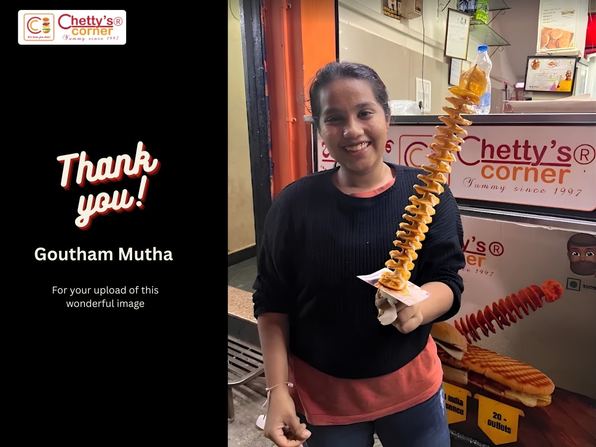 Customer holding an original crisp Twistato Potato Twister at Chetty's Corner Bangalore