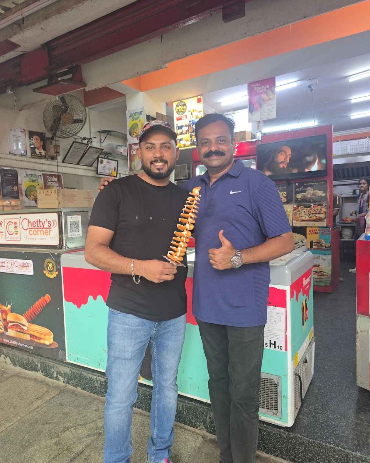 Rohit Samsukha and Anil Chetty holding the original 2013 Twistato at Chetty's Corner Bangalore